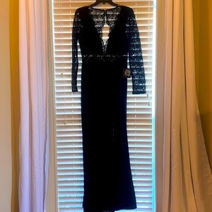 Formal long black dress with lace detailing on upper section and sleeves